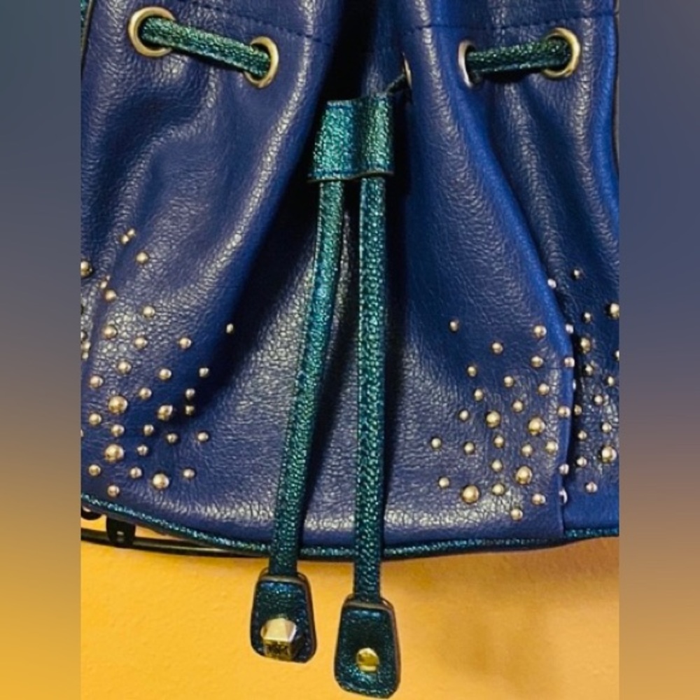 Kathy Van Zeeland shoulder bucket bag in vibrant indigo and studs